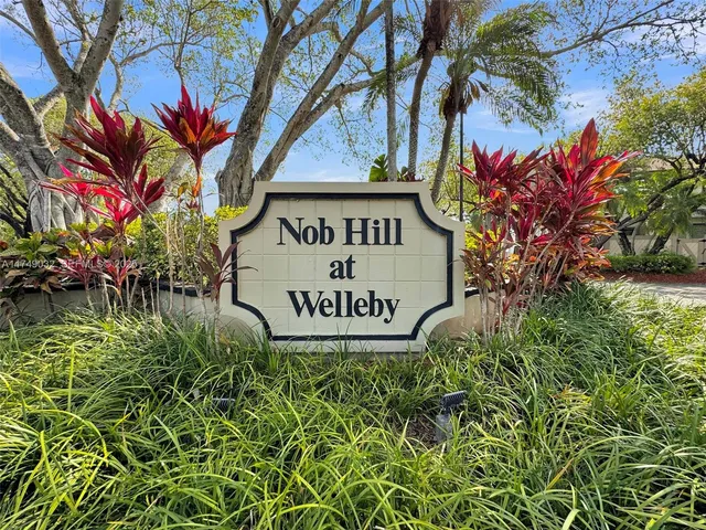 a sign that is sitting in front of a building