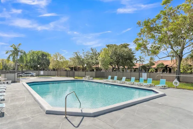 a view of a swimming pool with a lounge chairs