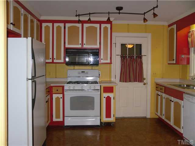8716 Master Court Raleigh, NC 27615 - Photo 8 of 15 a kitchen with stainless steel appliances granite countertop a stove a refrigerator and a microwave