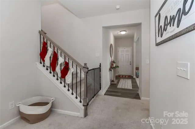 a view of a hallway with stairs