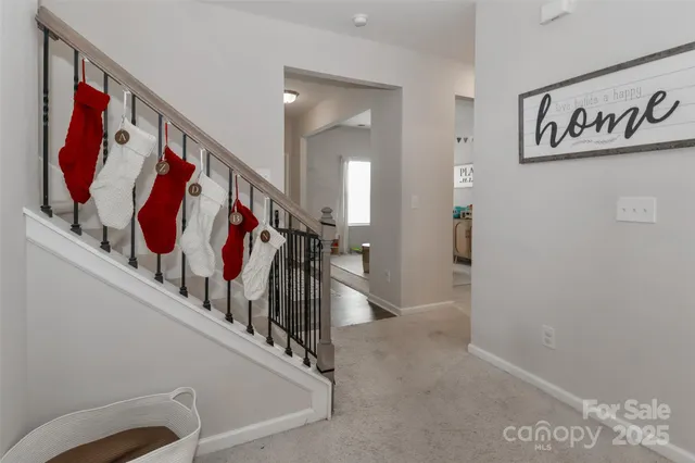 a view of a hallway with stairs