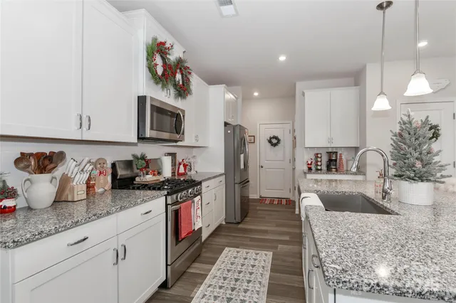 a kitchen with granite countertop lots of counter top space