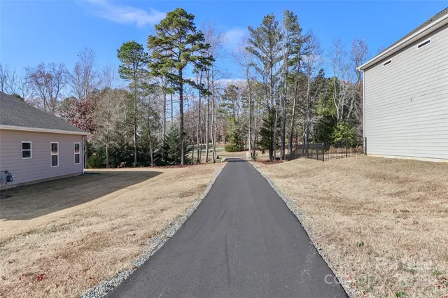 a backyard of apartments with large trees