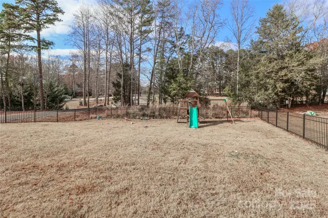 a view of outdoor space with garden and trees