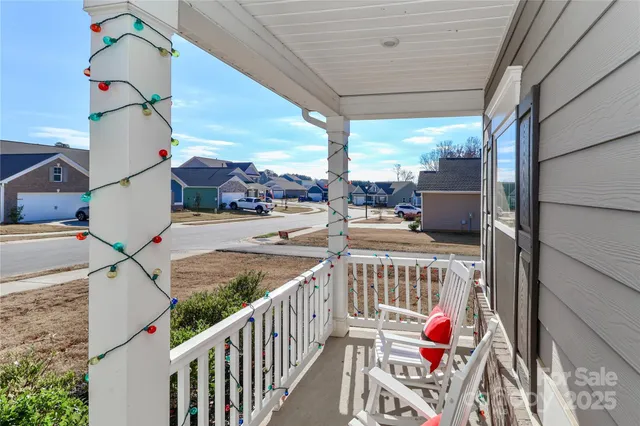 a view of balcony with furniture