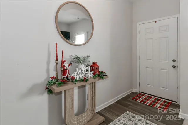 a picture of a room with a table and a potted plant