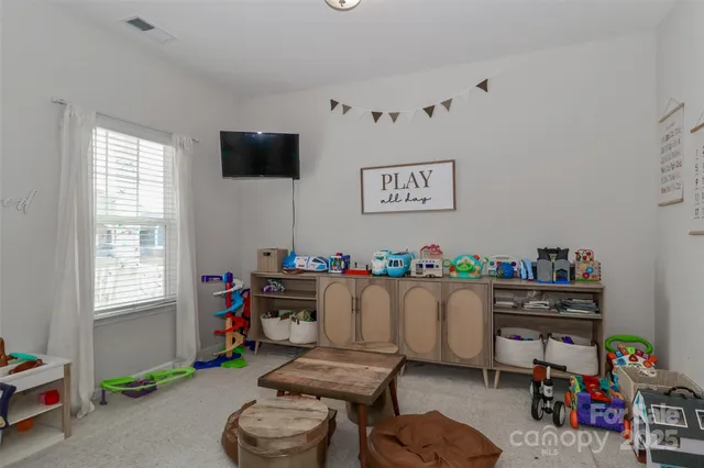 a room with furniture and a window