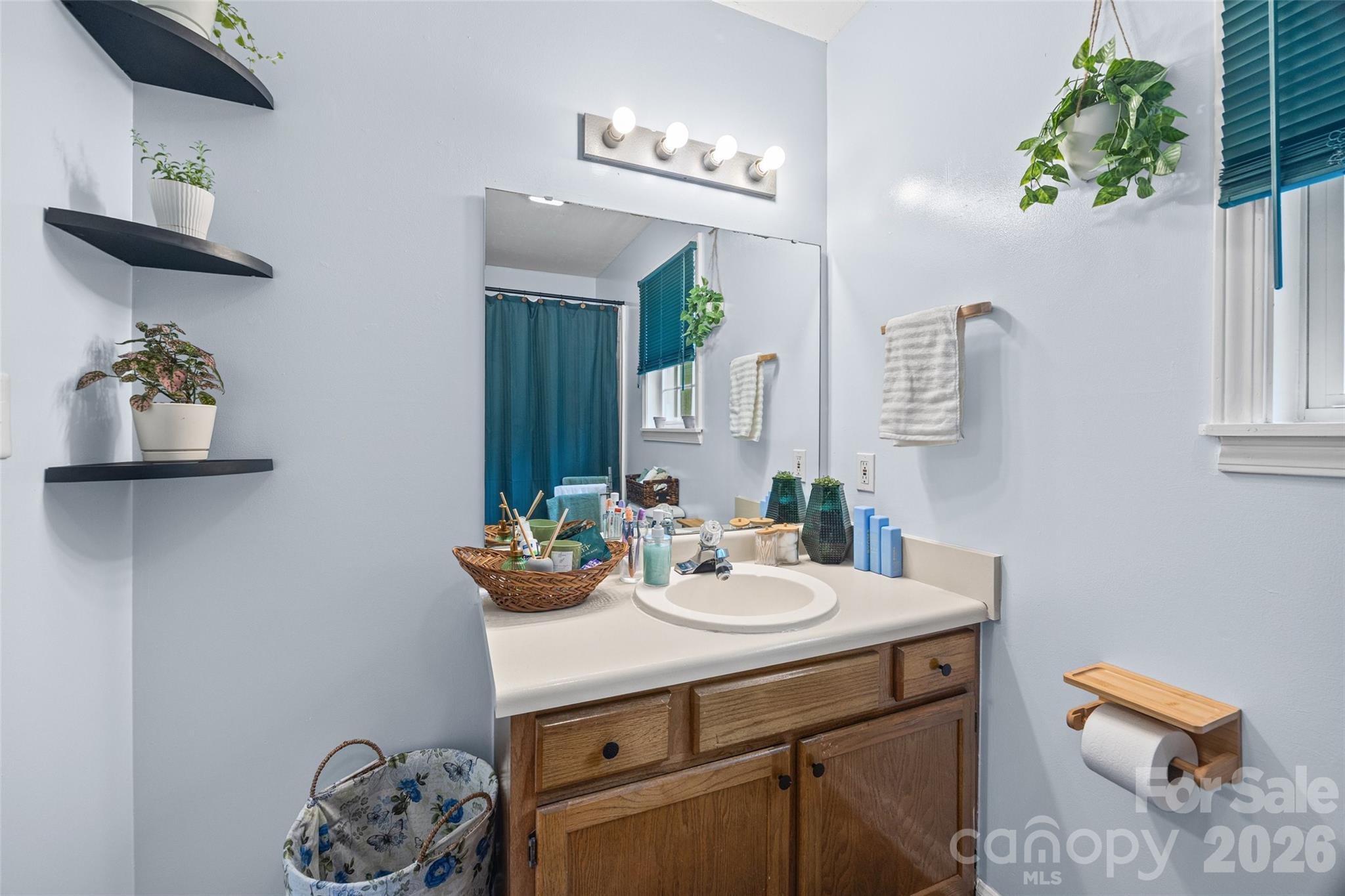 30 7th Street York, SC 29745 - Photo 23 of 29 a bathroom with a sink a mirror and vanity