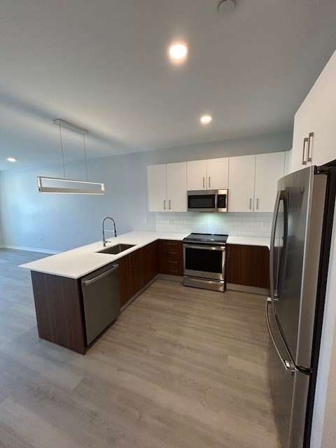 148 Old Post Road, Unit 216 Sharon, MA 02067 - Photo 1 of 22 a kitchen with stainless steel appliances granite countertop a refrigerator and a sink