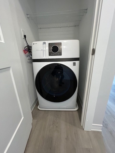 148 Old Post Road, Unit 216 Sharon, MA 02067 - Photo 13 of 20 a utility room with dryer and washer