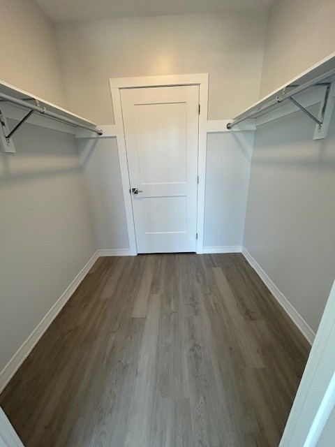 148 Old Post Road, Unit 216 Sharon, MA 02067 - Photo 16 of 22 an empty room with wooden floor and closet