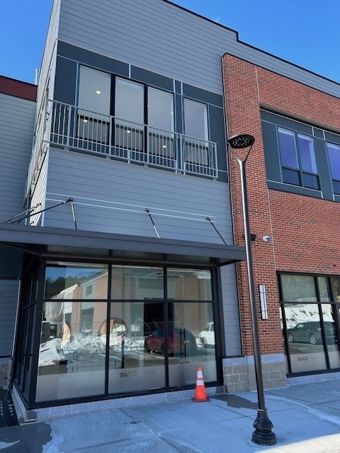 148 Old Post Road, Unit 216 Sharon, MA 02067 - Photo 20 of 22 a view of a building with sitting area