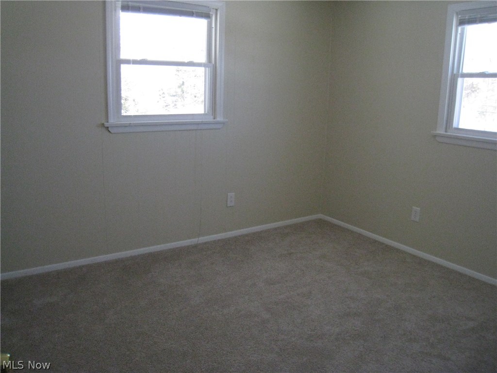 7160 Liberty Road Solon, OH 44139 - Photo 17 of 26 Second bedroom on the up stairs level with new carpeting, both rooms have been freshly painted.