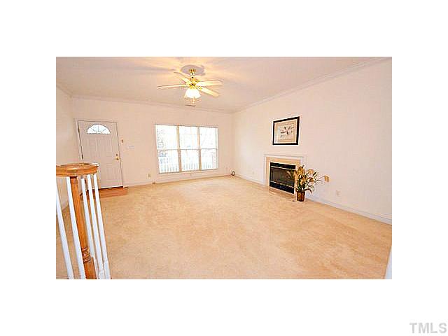 Hardwoods at the entry. Oversized family room with gas fireplace and crown molding.