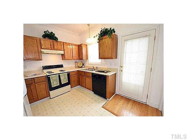 Another view of the kitchen with a door to the deck.