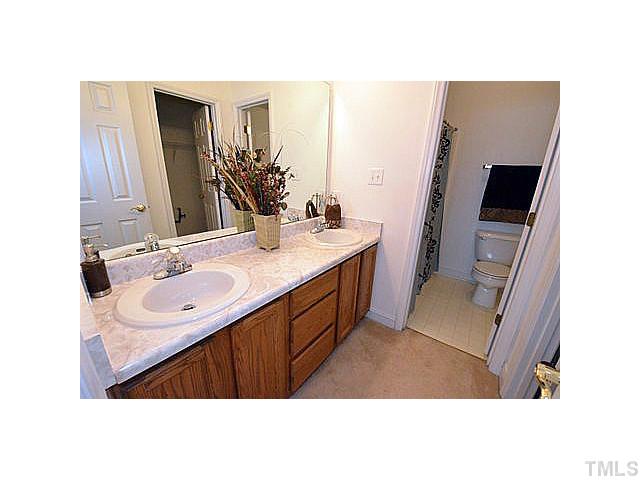 201 Reedhaven Drive Cary, NC 27513 - Photo 9 of 20 Master bathroom with dual sink marble vanity.