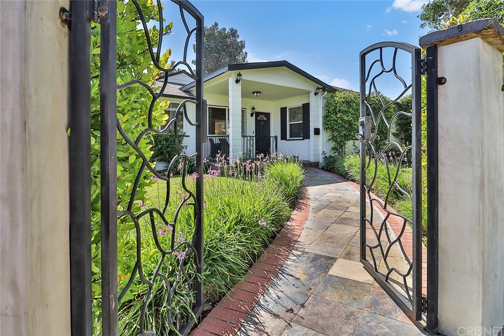 5732 Rhea Avenue Tarzana, CA 91356 - Photo 1 of 1 a front view of a house with garden