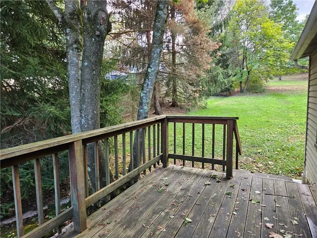 a view of a grassy field with trees