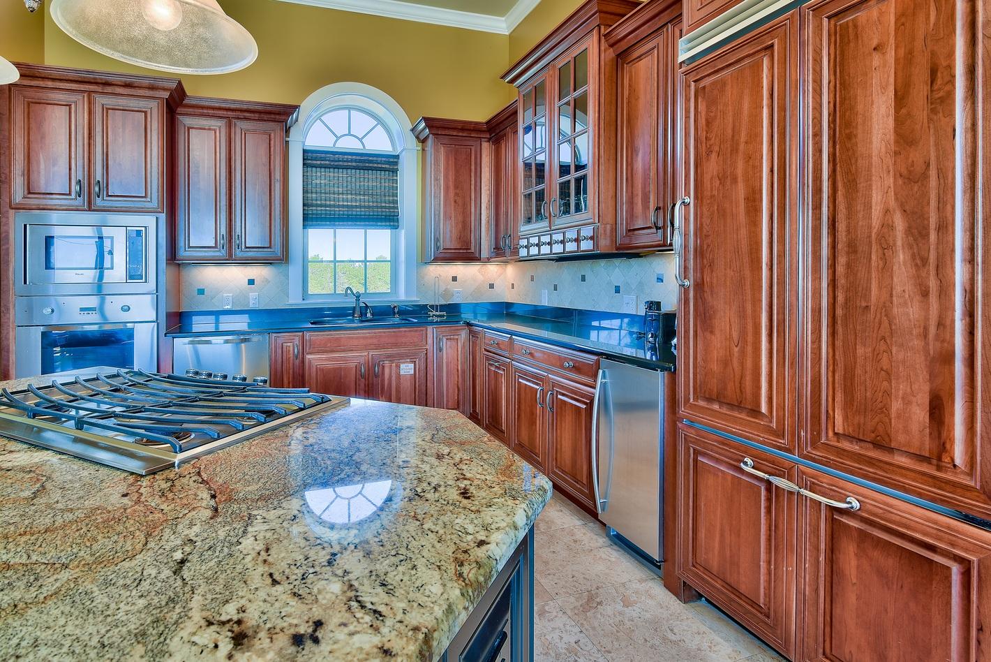 72 South Wall Street Inlet Beach, FL 32461 - Photo 12 of 27 a kitchen with stainless steel appliances granite countertop a sink stove and cabinets