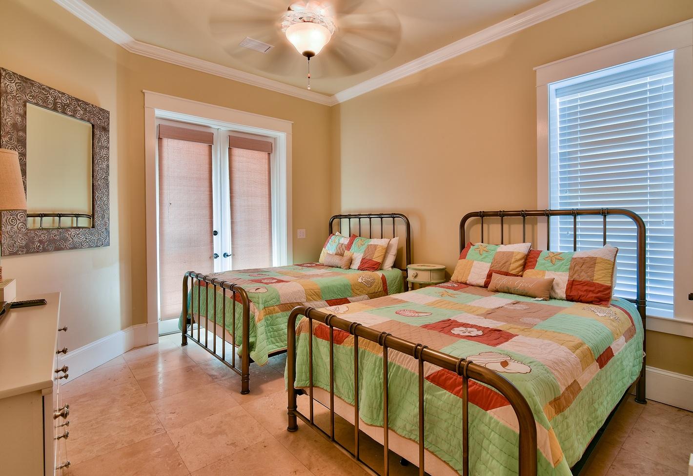 72 South Wall Street Inlet Beach, FL 32461 - Photo 3 of 27 a bedroom with two beds and a chandelier