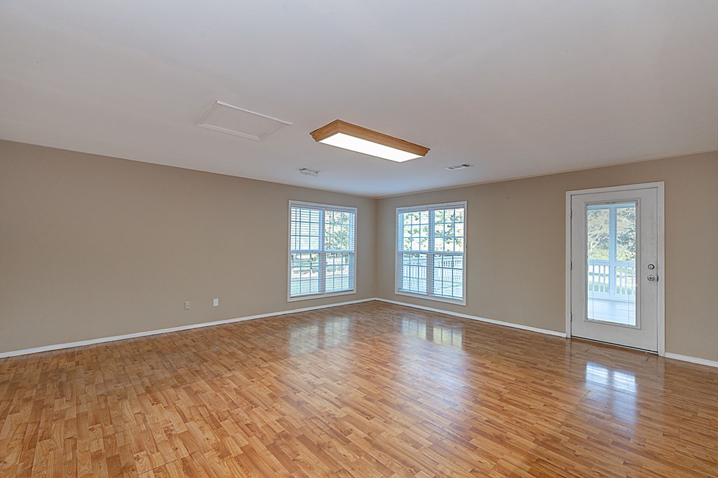 4085 Harris Road Ellerslie, GA 31807 - Photo 7 of 27 HUGE family room overlooking backyard & deck