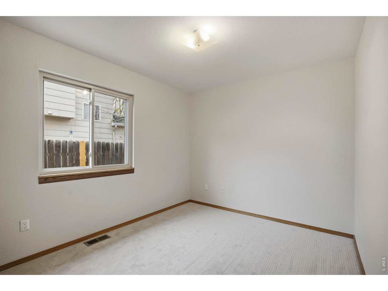1225 Alameda Street Fort Collins, CO 80521 - Photo 15 of 32 a view of an empty room with a window