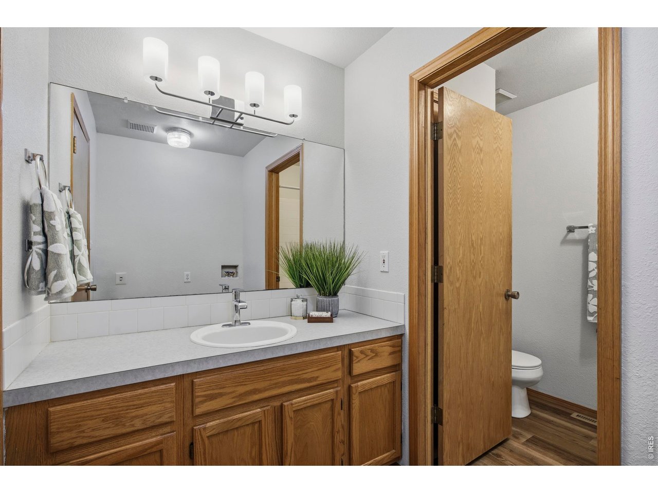 1225 Alameda Street Fort Collins, CO 80521 - Photo 16 of 32 a bathroom with a sink a toilet and shower
