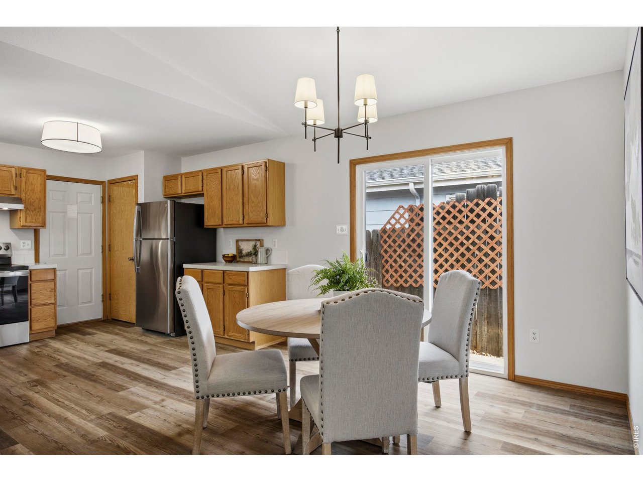 1225 Alameda Street Fort Collins, CO 80521 - Photo 6 of 32 a view of a dining room with furniture and wooden floor