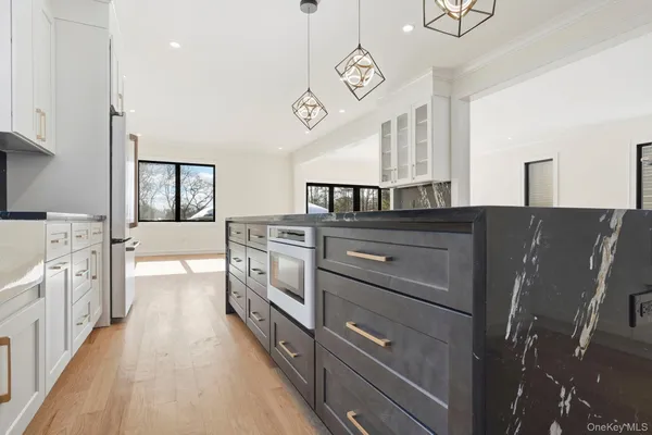 a kitchen with cabinets and window