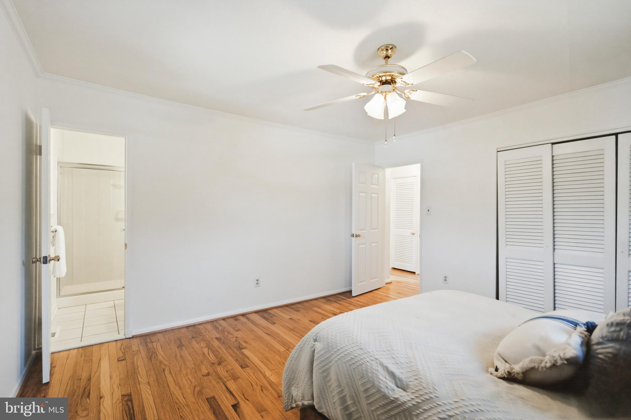 220 Solway Road Lutherville-Timonium, MD 21093 - Photo 14 of 38 a bedroom with a bed and a chandelier