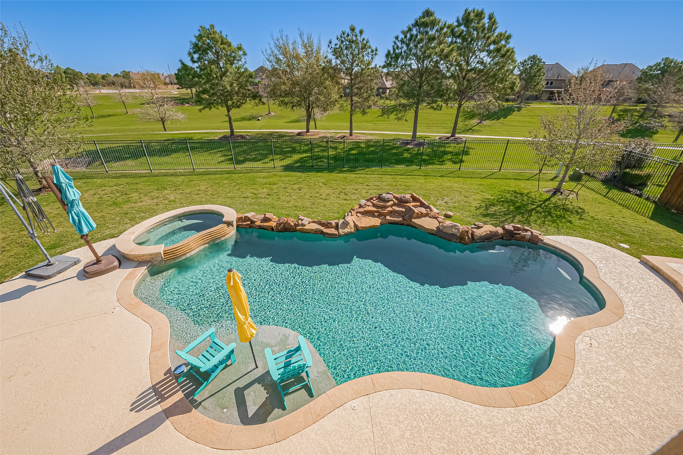 10018 Durango Path Lane Cypress, TX 77433 - Photo 45 of 50 Serene aerial view of the inviting pool and hot tub, perfect for relaxation.