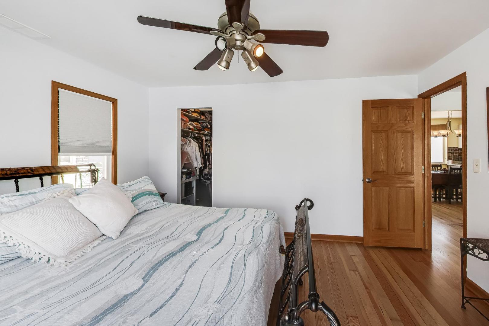 37464 North Terrace Lane Spring Grove, IL 60081 - Photo 13 of 40 a bedroom with a bed and a chandelier