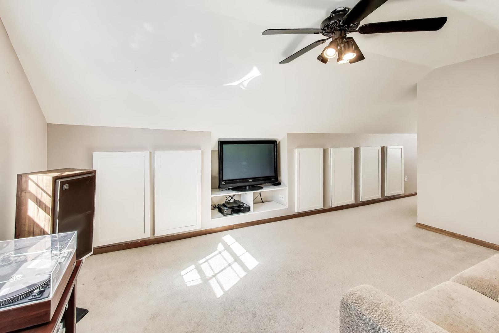 37464 North Terrace Lane Spring Grove, IL 60081 - Photo 21 of 40 a living room with furniture and a flat screen tv