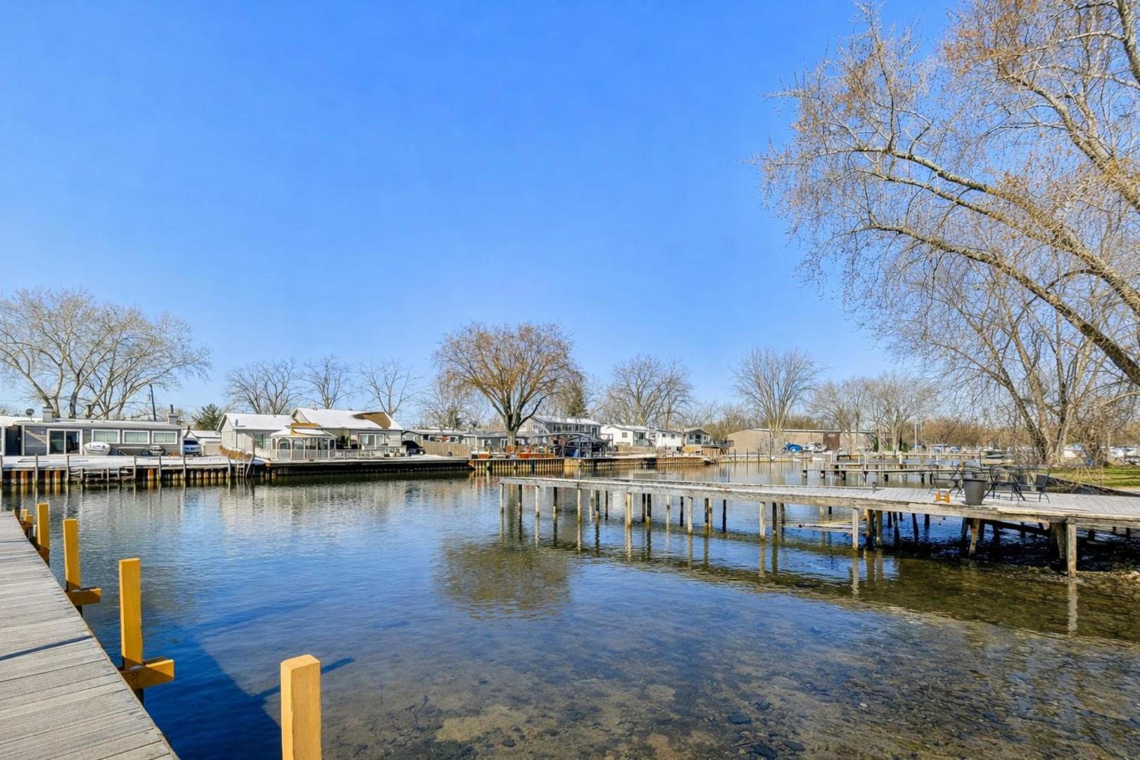 37464 North Terrace Lane Spring Grove, IL 60081 - Photo 34 of 40 a view of a lake with boats and trees in the background