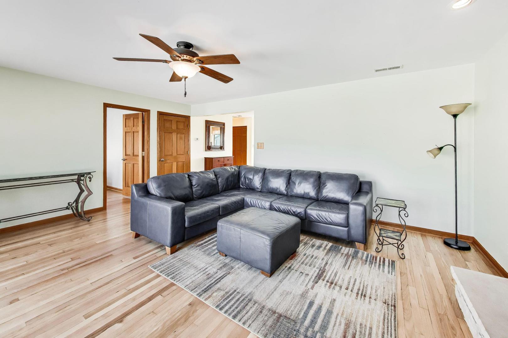 37464 North Terrace Lane Spring Grove, IL 60081 - Photo 4 of 40 a living room with furniture and a wooden floor
