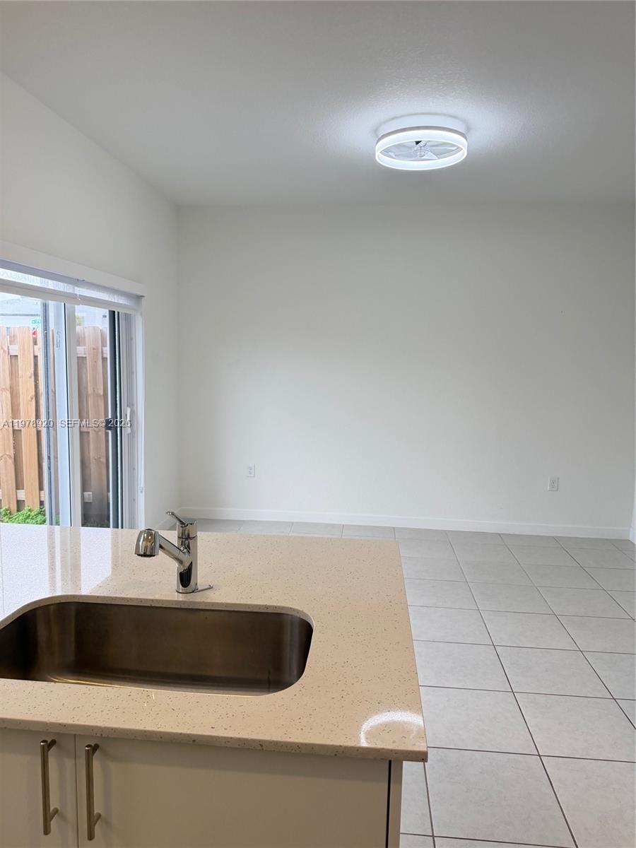 17953 Southwest 359th Street Homestead, FL 33034 - Photo 13 of 36 a sink sitting next to a lamp