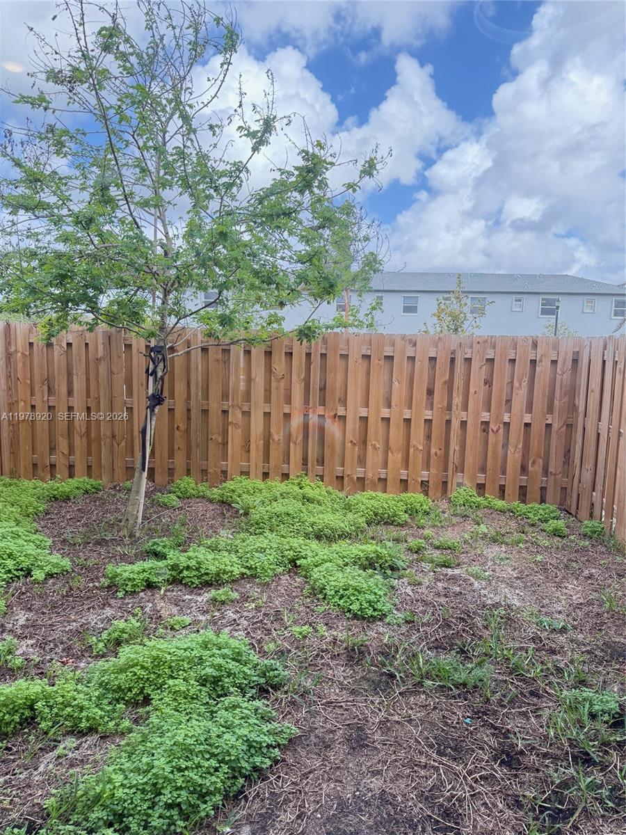 17953 Southwest 359th Street Homestead, FL 33034 - Photo 15 of 36 a backyard of a house with lots of green space