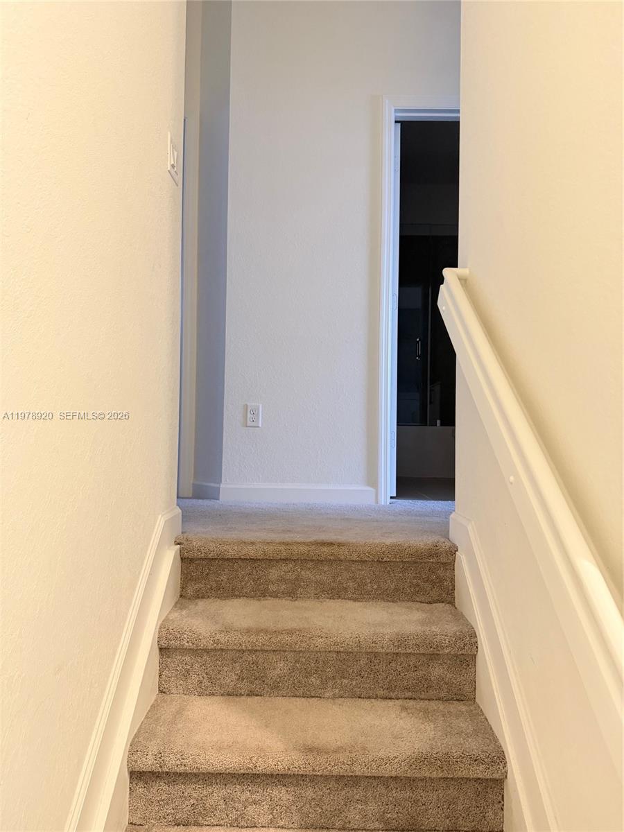 17953 Southwest 359th Street Homestead, FL 33034 - Photo 17 of 36 a view of staircase with white walls