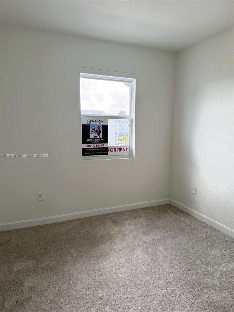17953 Southwest 359th Street Homestead, FL 33034 - Photo 20 of 36 an empty room with a window