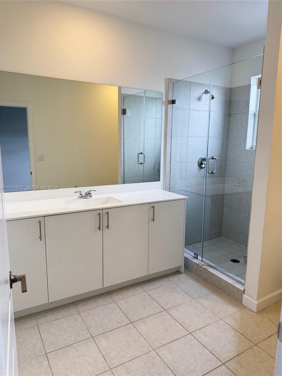 17953 Southwest 359th Street Homestead, FL 33034 - Photo 22 of 36 a bathroom with a shower and a sink