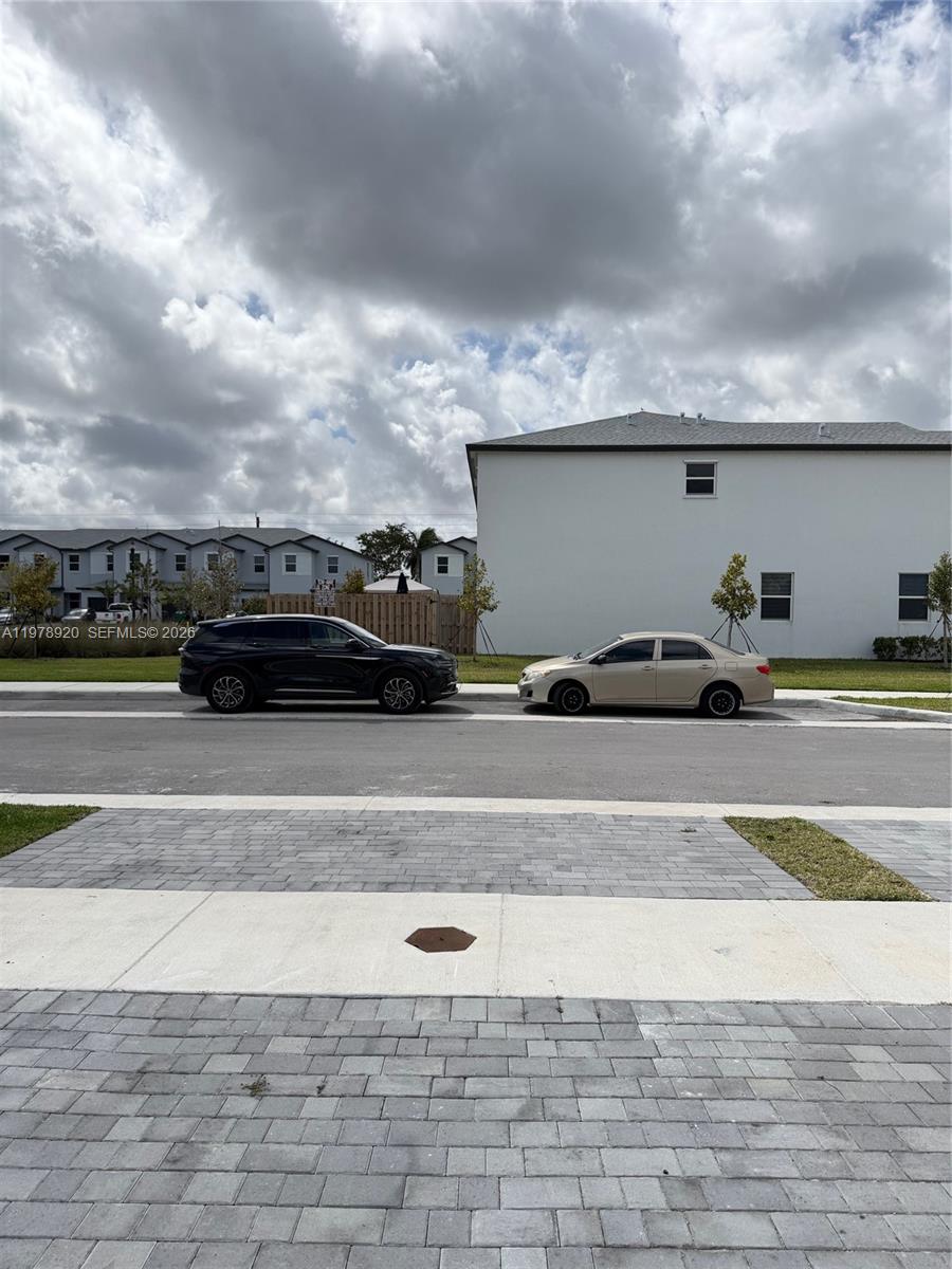 17953 Southwest 359th Street Homestead, FL 33034 - Photo 4 of 36 a view of parking with cars parked