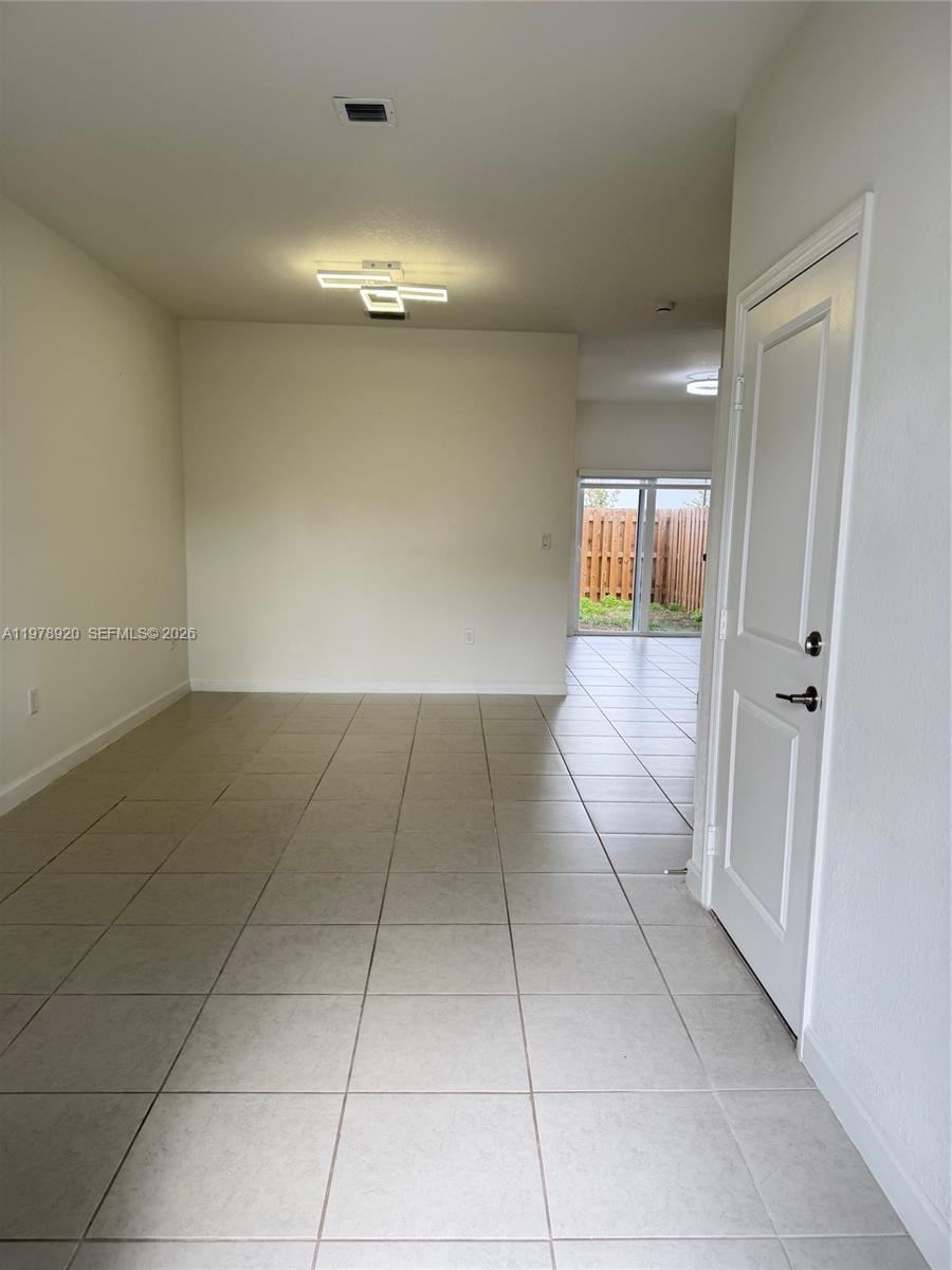 17953 Southwest 359th Street Homestead, FL 33034 - Photo 8 of 36 a view of a hallway to rooms
