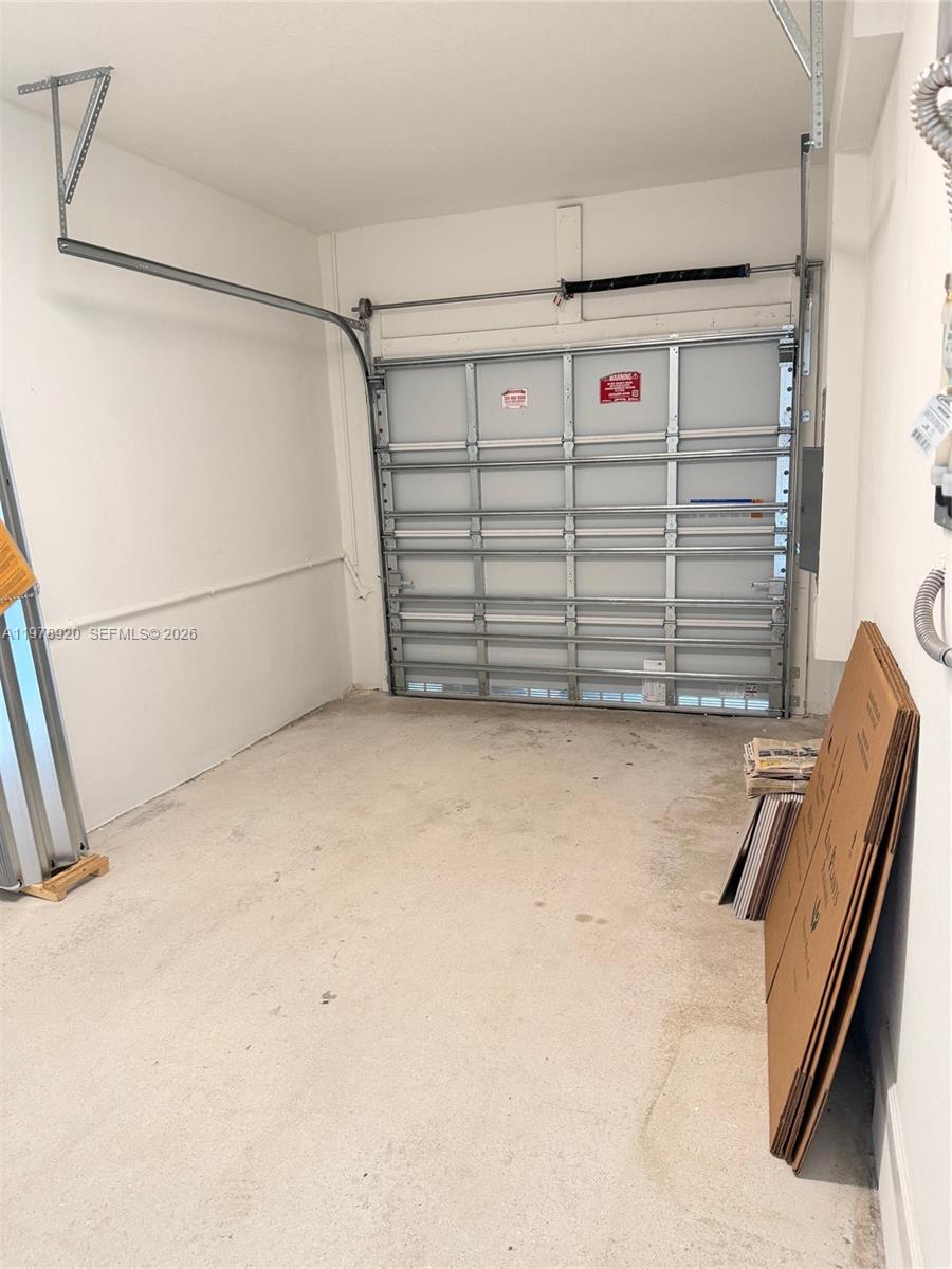 17953 Southwest 359th Street Homestead, FL 33034 - Photo 9 of 36 a view of a garage with storage