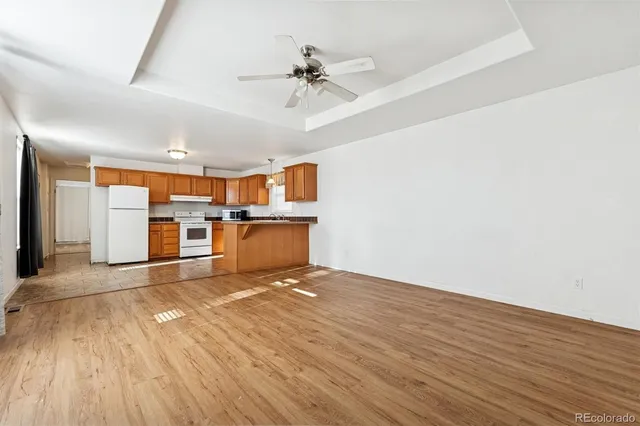 a view of a kitchen with a sink and a window