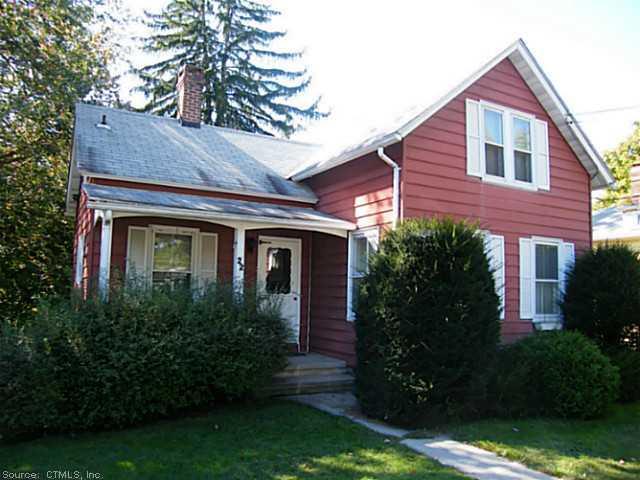 22 Deep River Road Essex, CT 06409 - Photo 1 of 1 a front view of a house with garden