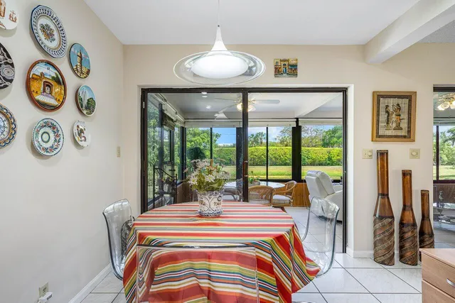 a bedroom with a bed and a large window with outer view
