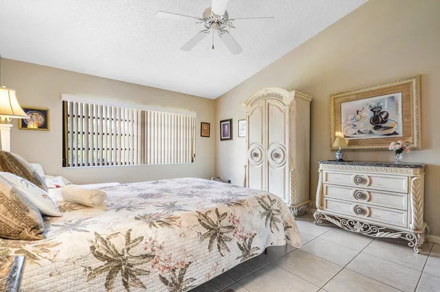 a bedroom with a bed and a cabinets