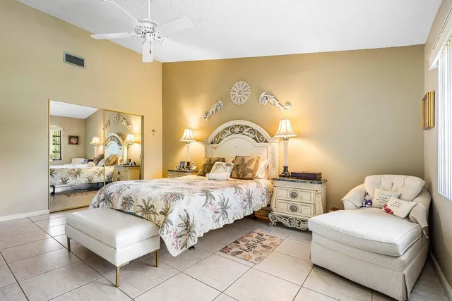 a bedroom with a bed and a couch