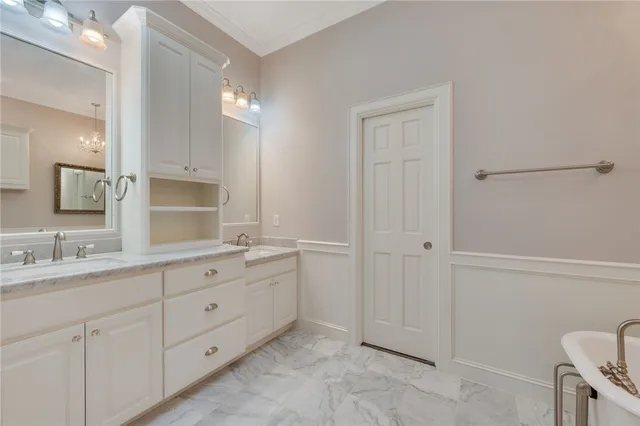 a spacious bathroom with a granite countertop sink a mirror and a