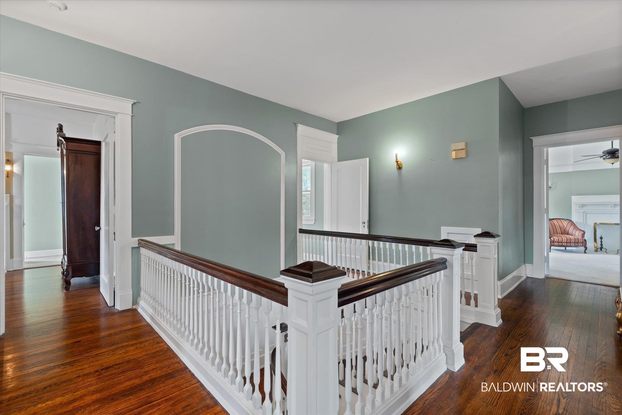 1953 Dauphin Street Mobile, AL 36606 - Photo 18 of 56 Corridor featuring a barn door and dark hardwood / wood-style floors
